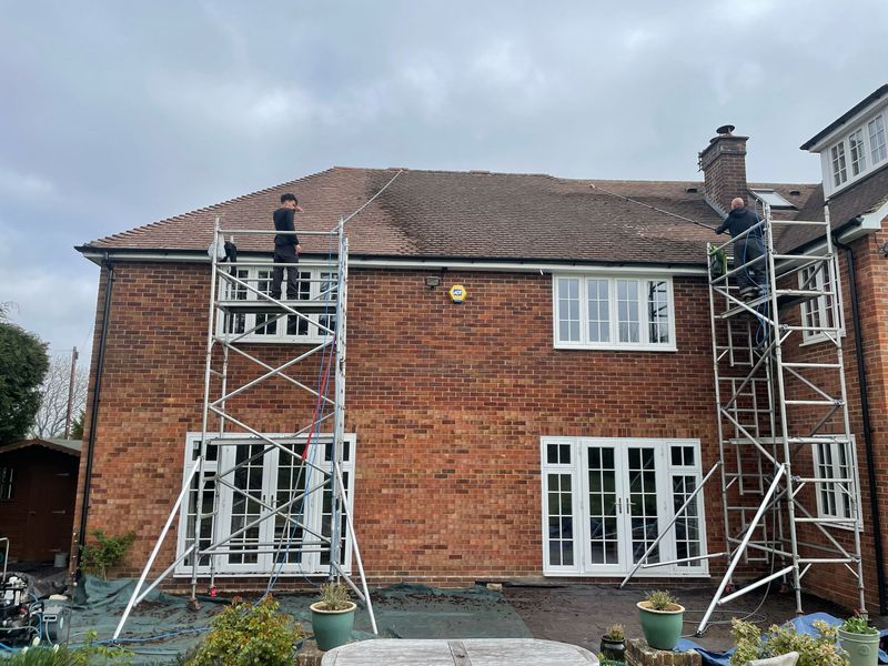 Roof cleaning carried out safely from scaffold towers by The Roof Moss Cleaners in Southam